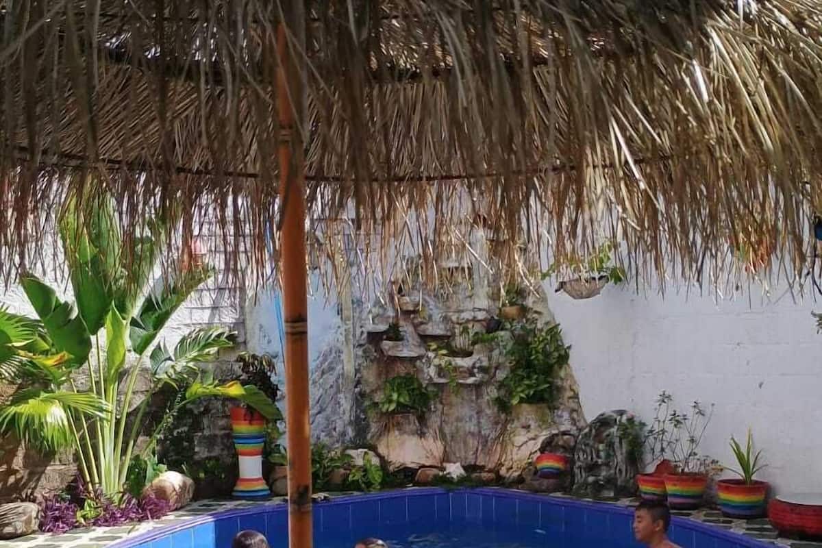 Economy Quadruple Room, Pool View | Terrace/patio