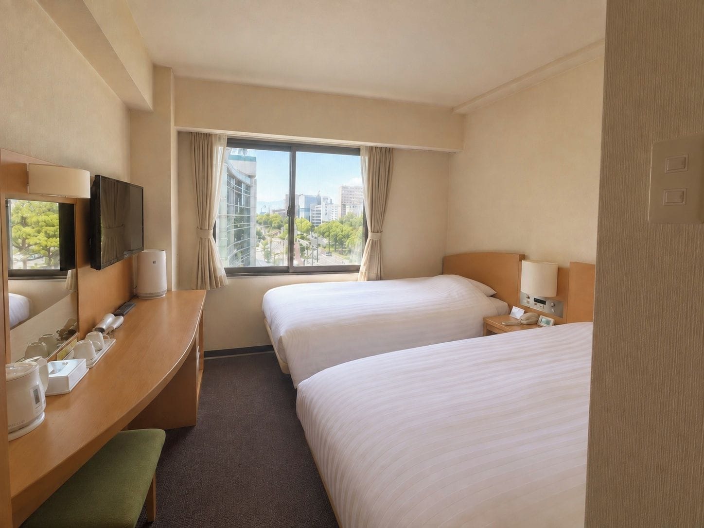 A hotel room with two beds, a desk with a mirror, a television, and a window with a city view.