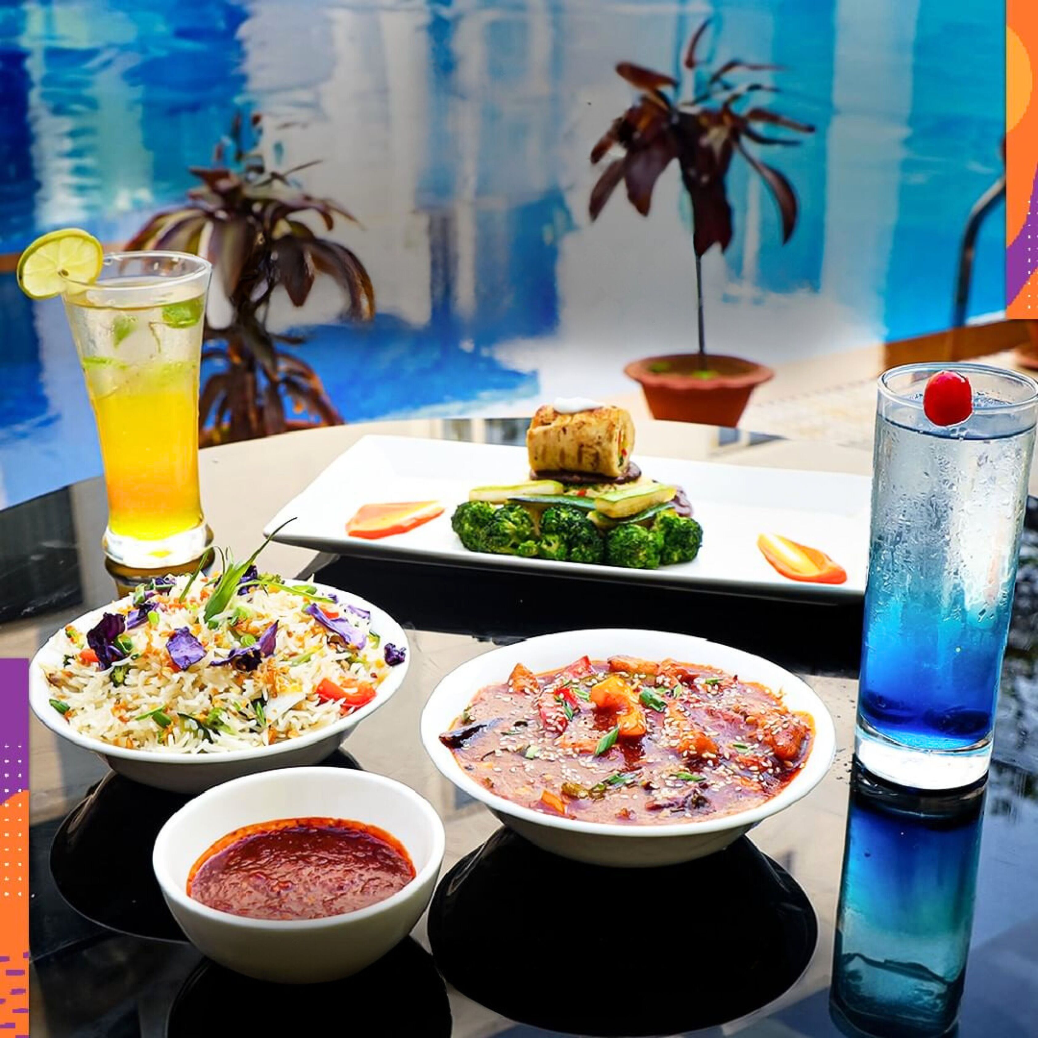 Una mesa con diversos platos, bebidas y un cuadro al fondo.