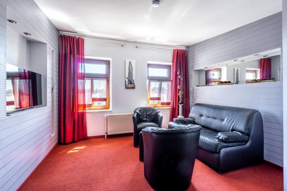 family suite, bathtub | living area | flat-screen tv