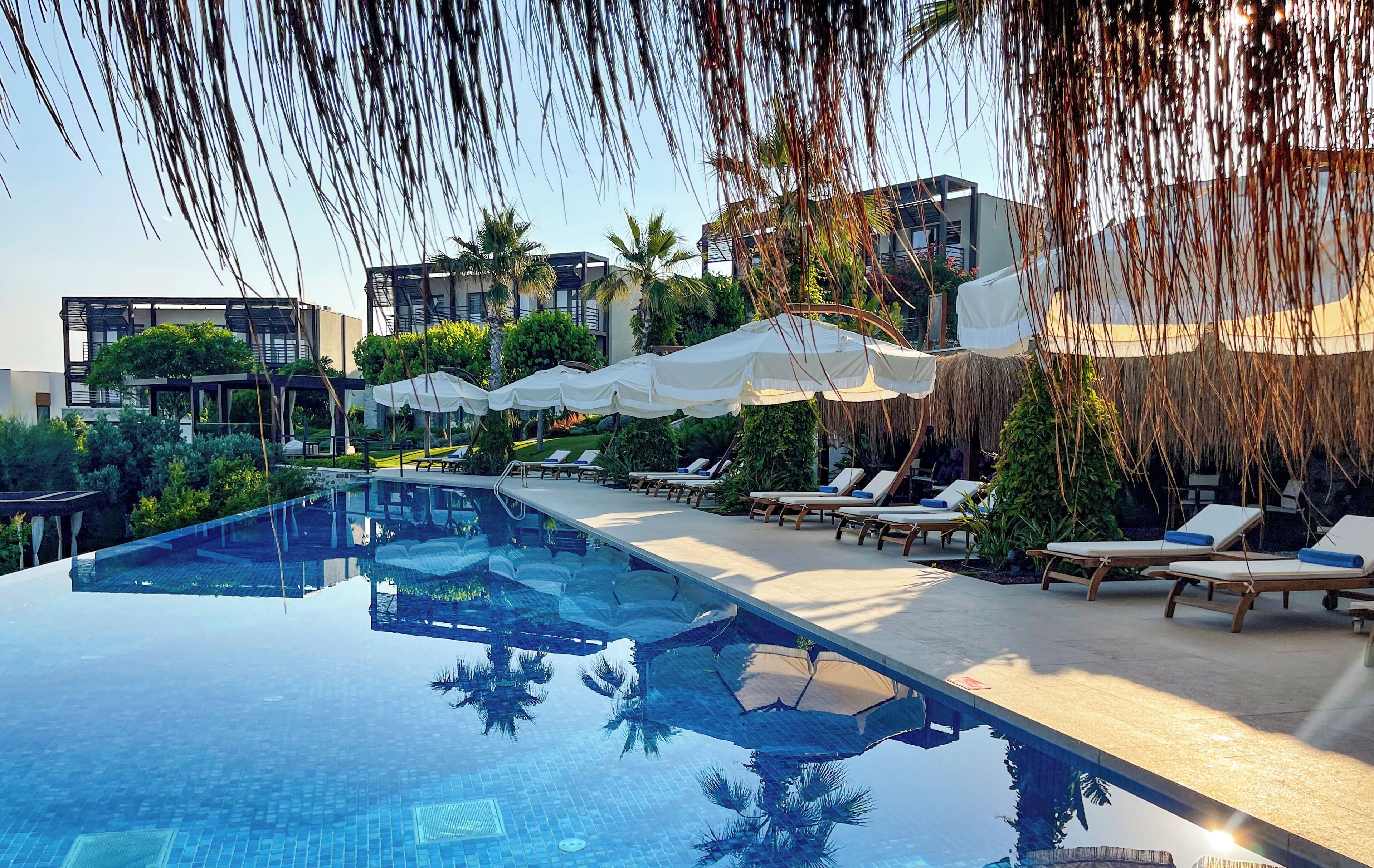 seasonal outdoor pool, a heated pool, free pool cabanas, pool umbrellas