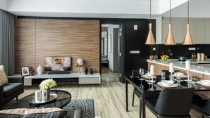A modern living room with a sofa, coffee table, and dining area. - Somerset Damansara Utama Petaling Jaya (Petaling Jaya)