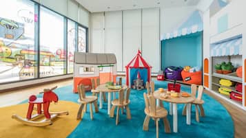 Children can play and learn in this bright, inviting space with comfortable seating and a variety of toys.