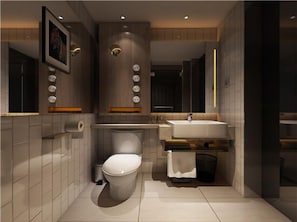 Une salle de bain moderne avec des toilettes, un lavabo et un miroir.