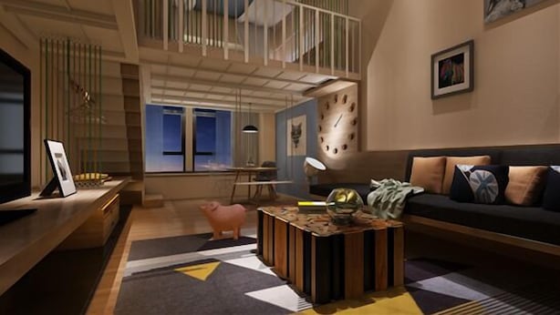 A modern living room with a high ceiling, a wooden coffee table, a sofa with cushions, a piggy bank, and a clock on the wall. - Iway International Holiday Apartment (Guangzhou)