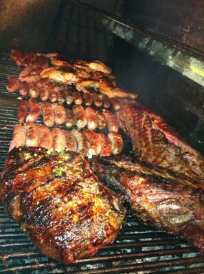 Enjoy a communal barbecue experience with a variety of meats grilled to perfection.