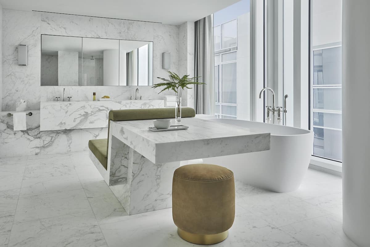 designer toiletries, hair dryer, bathrobes, slippers