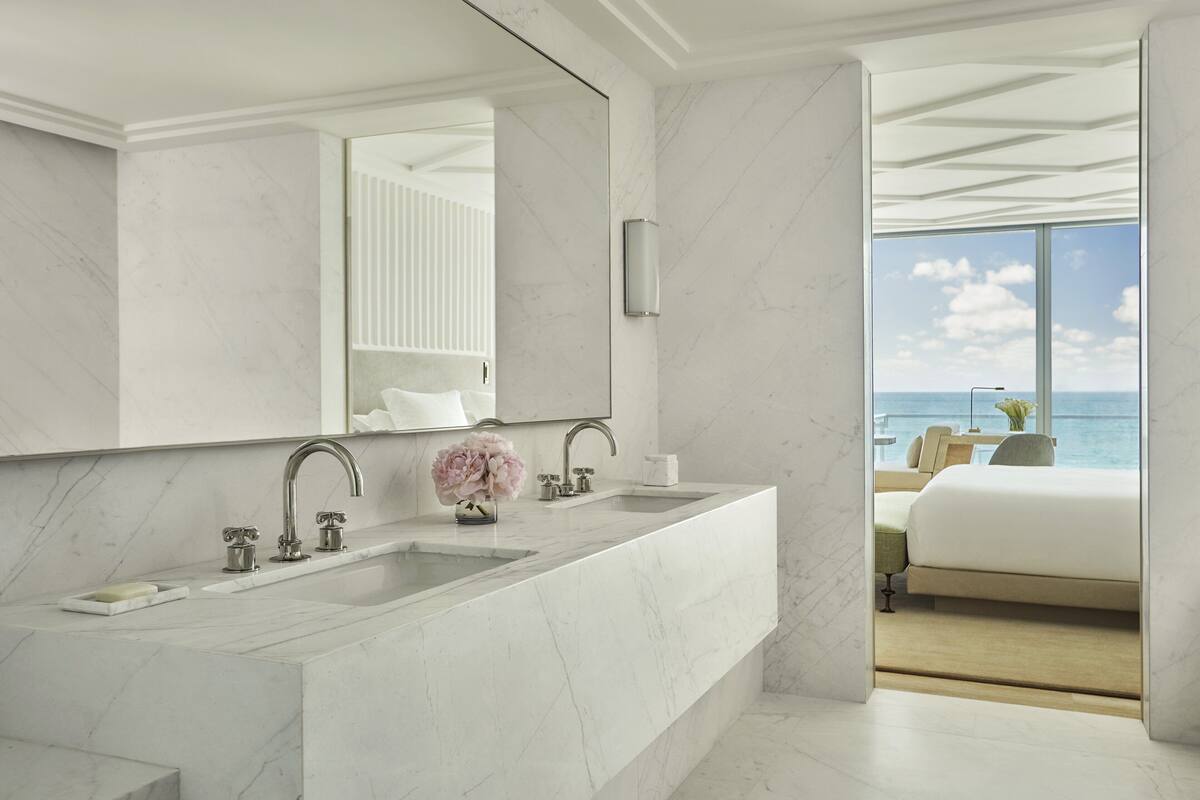 designer toiletries, hair dryer, bathrobes, slippers