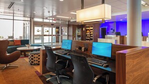 A modern office space with cubicles, computers, and a reception area. - Fairfield Inn & Suites by Marriott Sidney (Sidney)