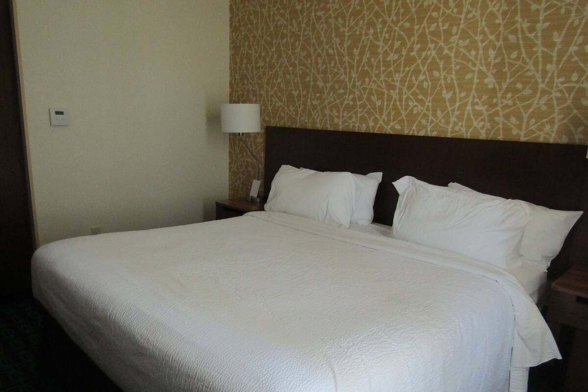 desk, laptop workspace, blackout curtains, iron/ironing board