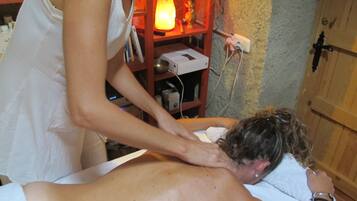 Experience a soothing massage in a serene space with a skilled therapist.