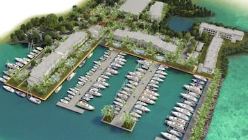 An aerial view of a marina with multiple docks, boats, and buildings.