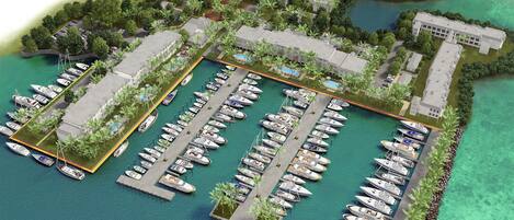 An aerial view of a marina with multiple docks, boats, and buildings.