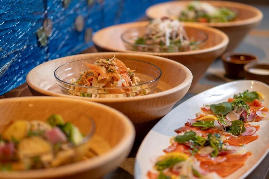 A variety of dishes served in different bowls and plates, suggesting a dining setting.