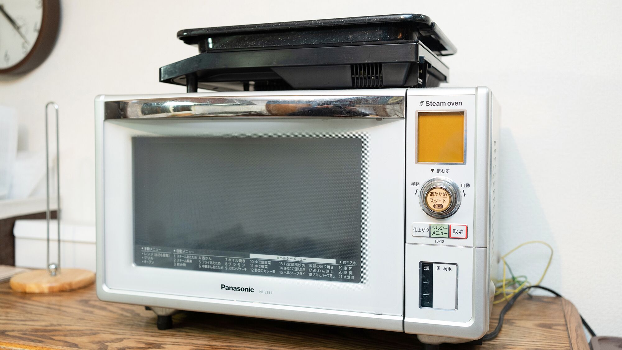 A Panasonic steam oven with a digital display, control buttons, and a timer.