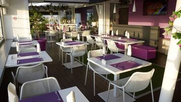 An outdoor dining area with white tables and chairs, purple table runners, and potted plants.