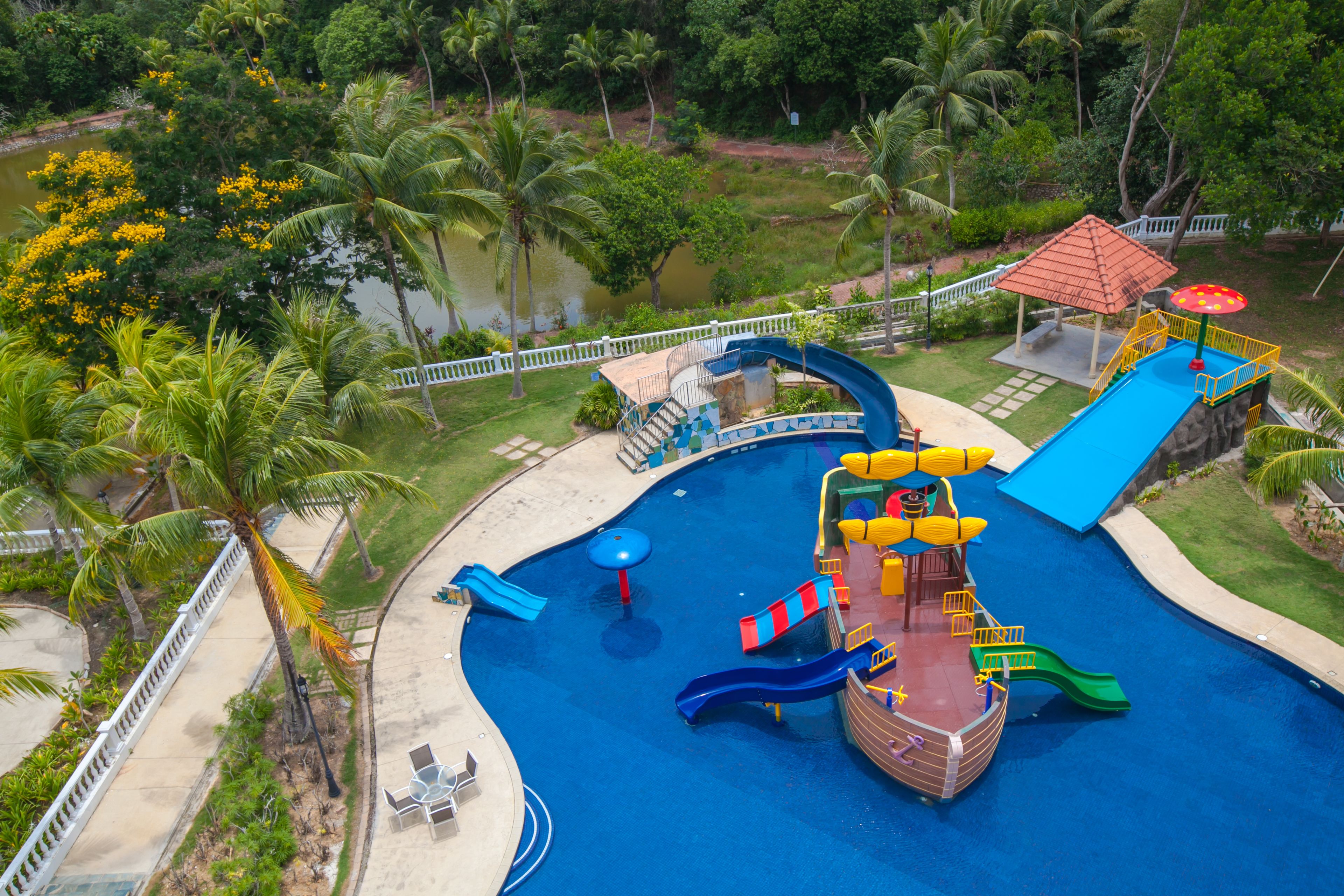 A water park with slides, a boat ride, and a pool.