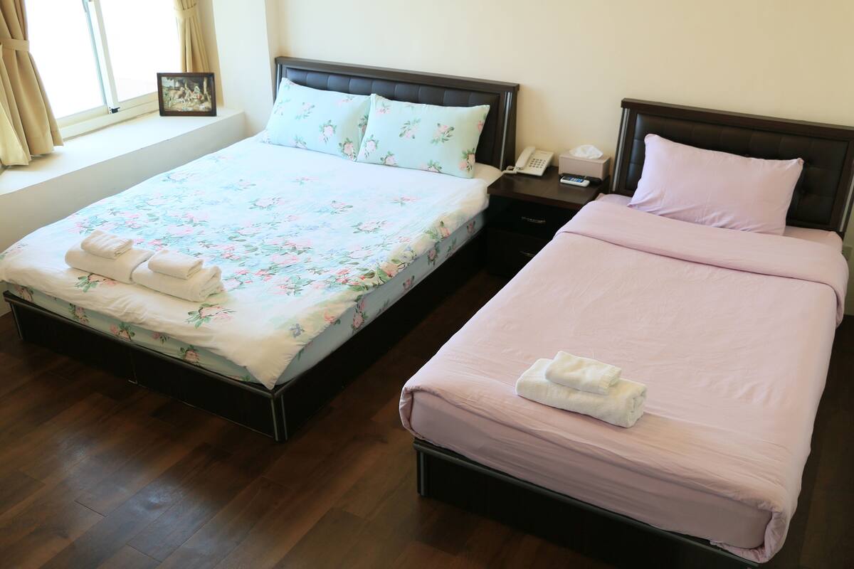 Deluxe Quadruple Room | 1 bedroom, premium bedding, desk, blackout drapes