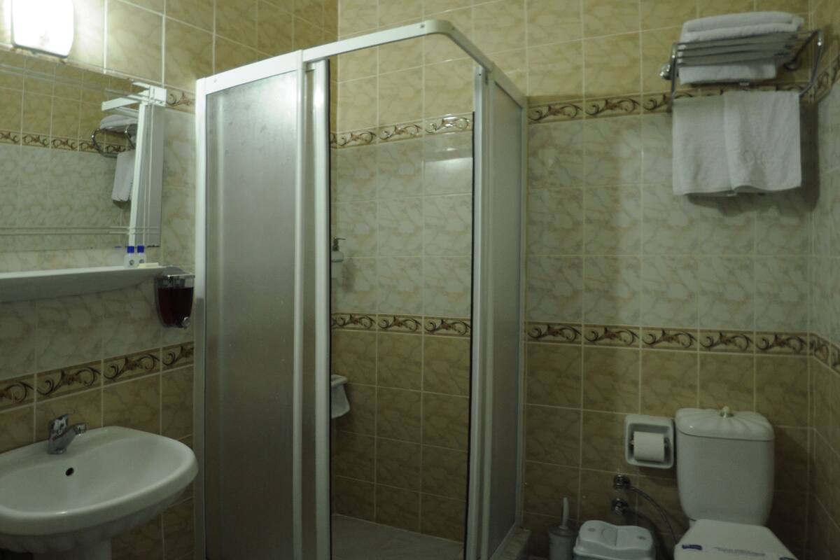 Shower, free toiletries, hair dryer, slippers