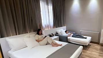 Family Triple Room, 1 Bedroom | Premium bedding, minibar, in-room safe, desk