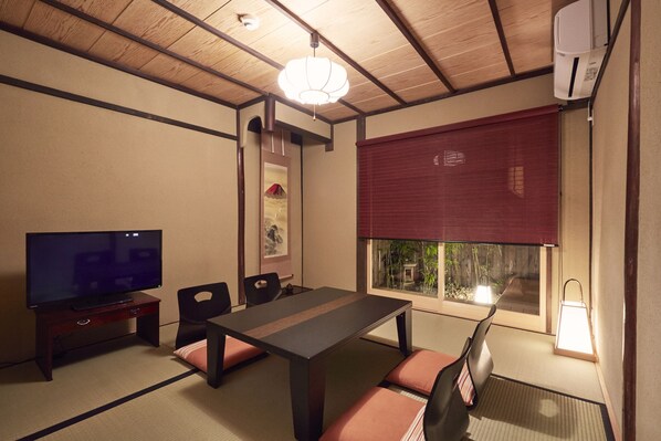 Japanese Style Townhouse (Beds + Futons) | Living area | Flat-screen TV