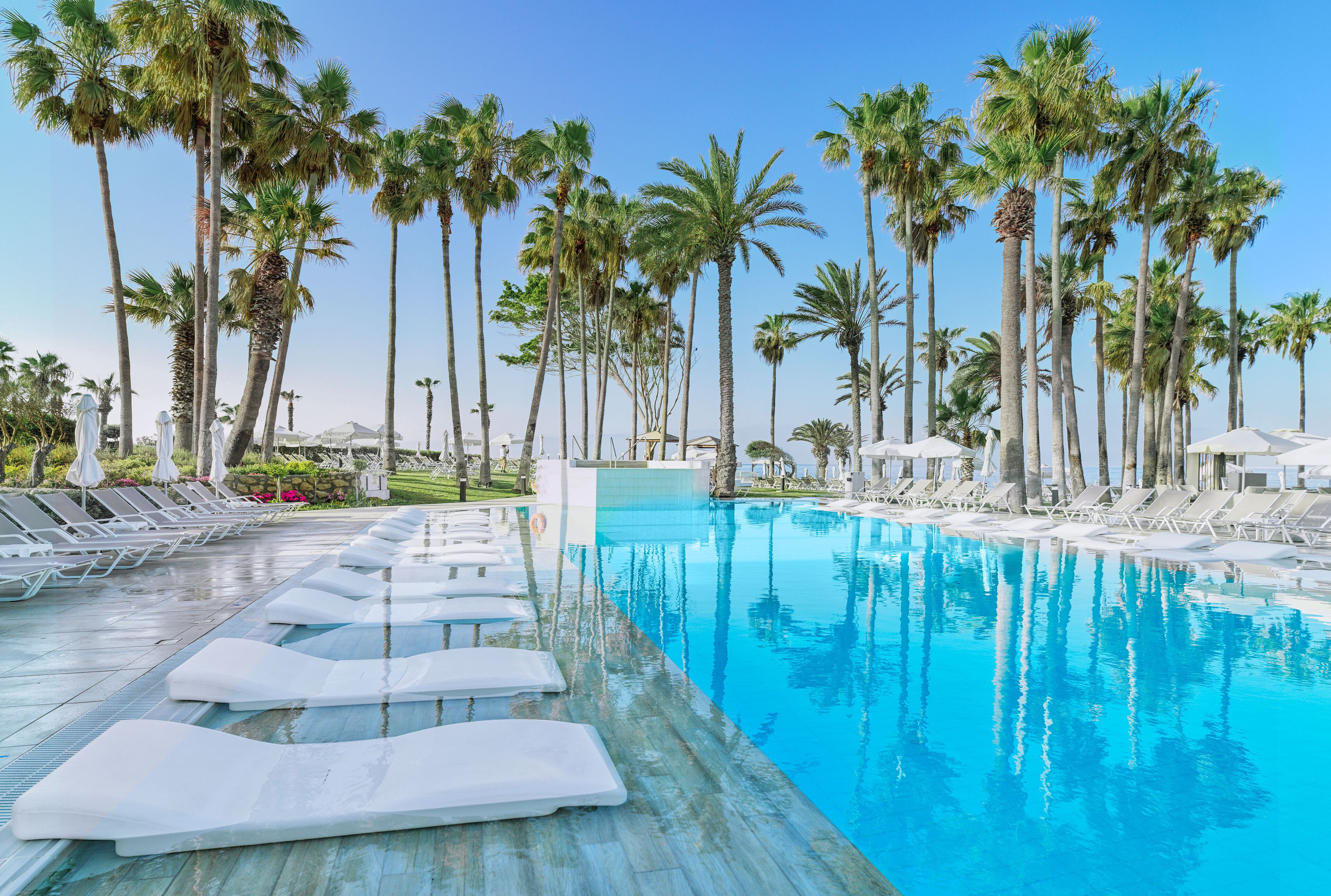 indoor pool, outdoor pool, pool umbrellas, pool loungers