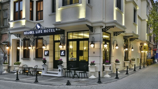 The exterior of the Istanbul Life Hotel with a classic facade, outdoor seating, and decorative lighting. - Istanbul Life Hotel - Adults Only (Istanbul)