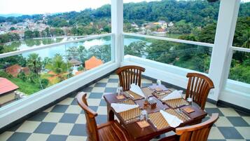 Enjoy a panoramic view of the surrounding landscape from this corner room's large window.