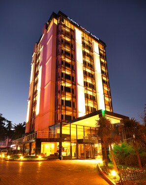 A multi-story hotel with a prominent entrance and a glass facade. - North Point Hotel (Samsun)