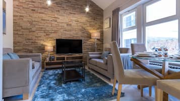 Executive Apartment, 1 Bedroom, Kitchen | Living room | Flat-screen TV