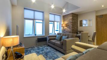 Executive Apartment, 2 Bedrooms, Kitchen | Living room | Flat-screen TV