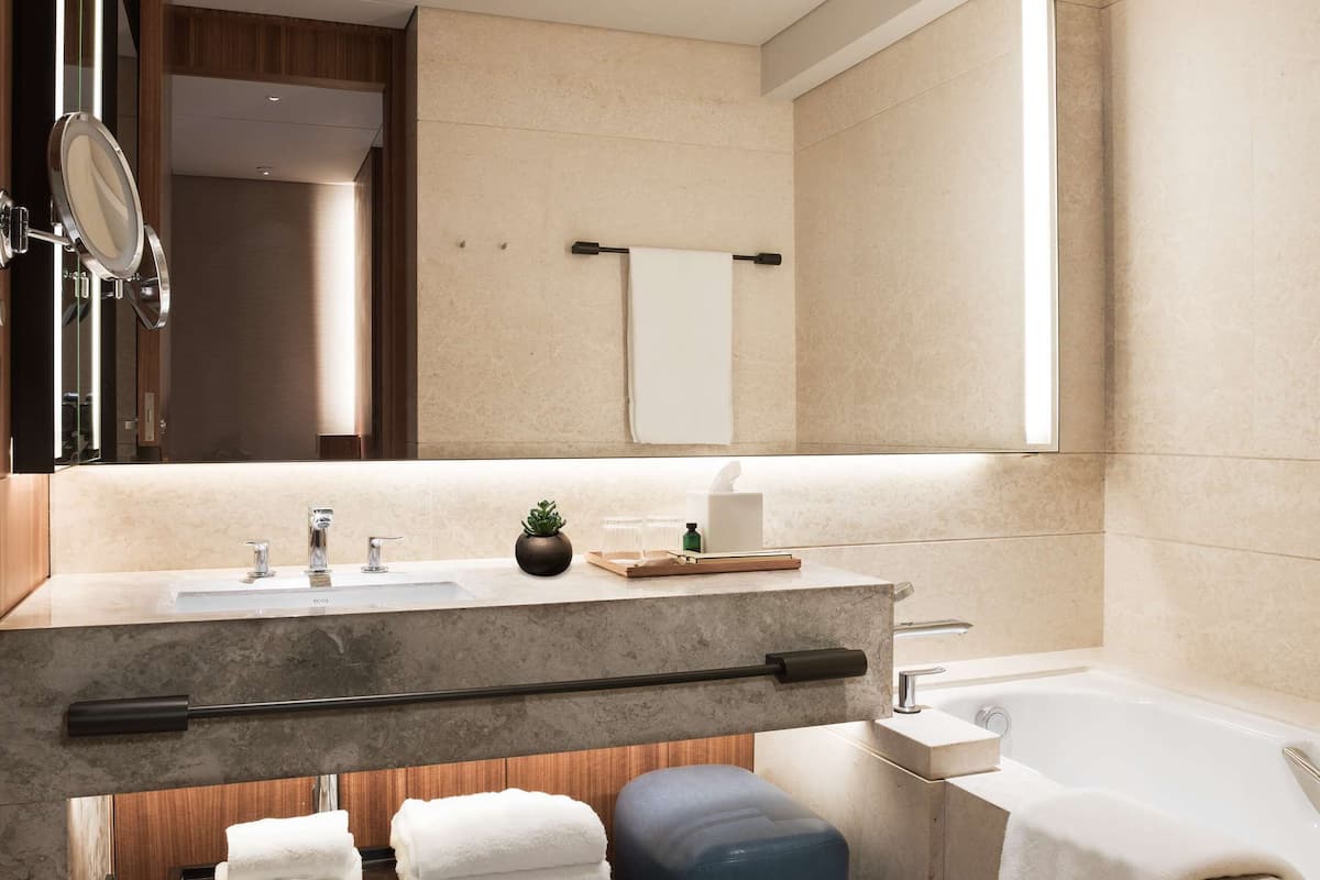 hair dryer, bathrobes, slippers, towels