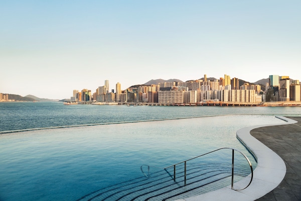 Seasonal outdoor pool, open 7:00 AM to 10:00 PM, pool umbrellas
