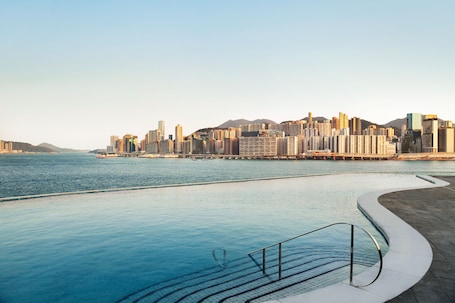 Seasonal outdoor pool, open 7:00 AM to 10:00 PM, pool umbrellas