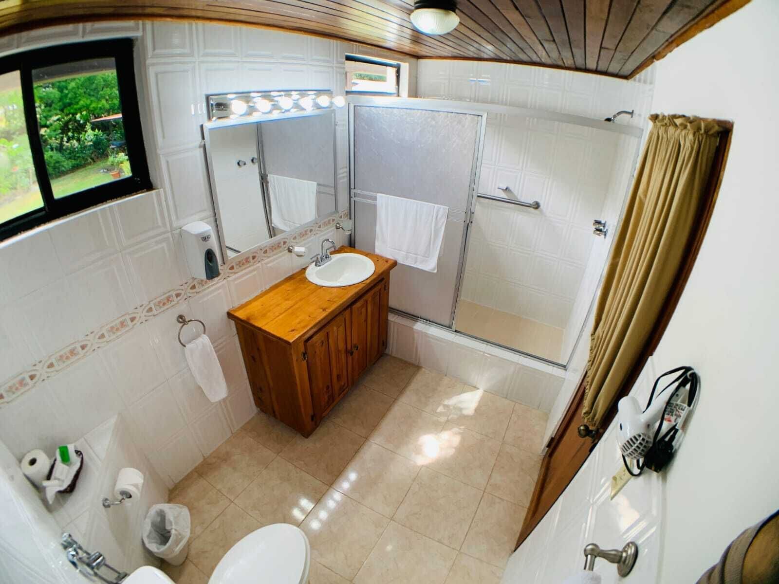 junior suite, river view | bathroom | shower, free toiletries, hair dryer, towels