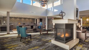 A spacious lobby with a fireplace, seating area, and a reception desk. - Residence Inn by Marriott Fishkill (Fishkill)
