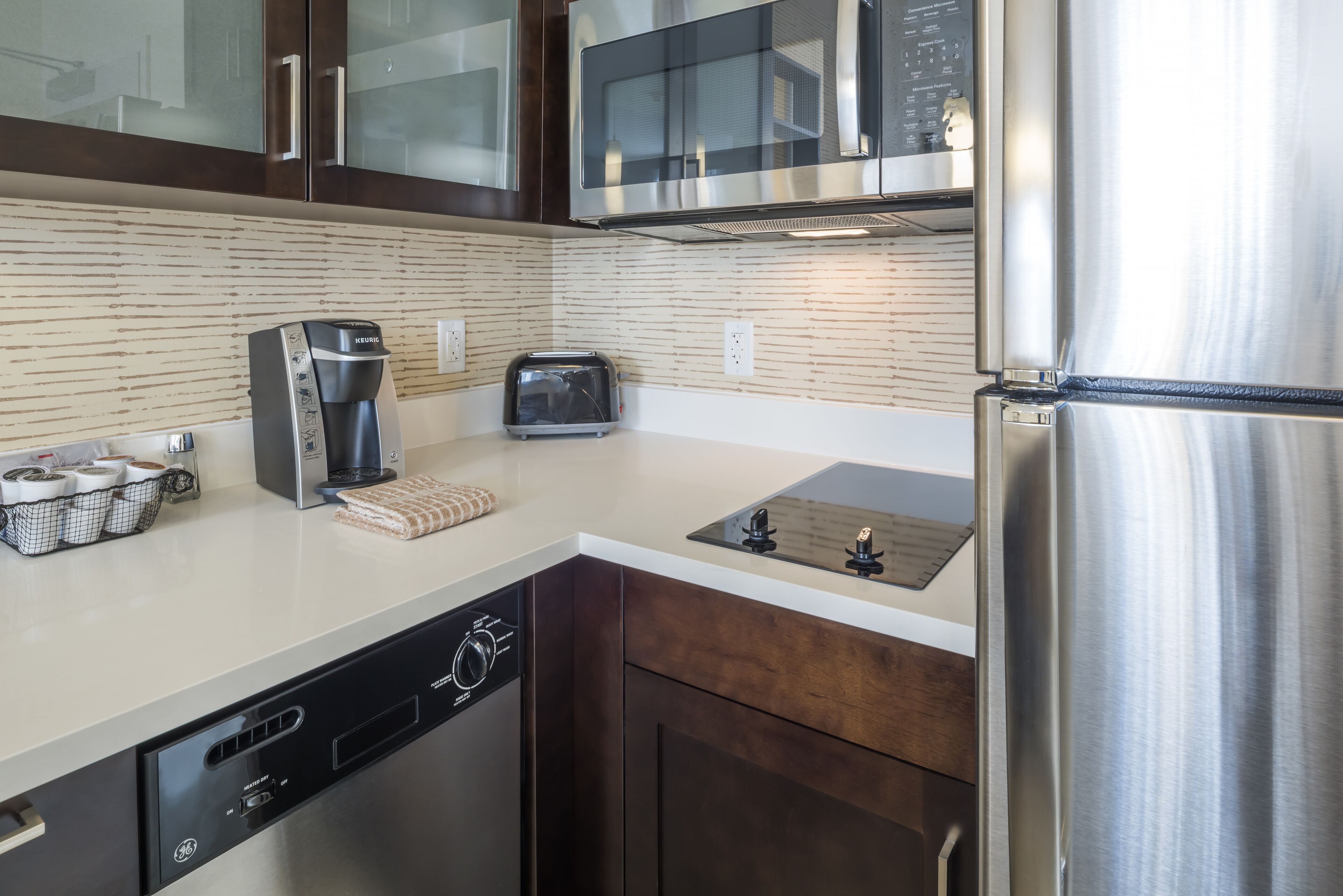 full-sized fridge, microwave, stovetop, dishwasher