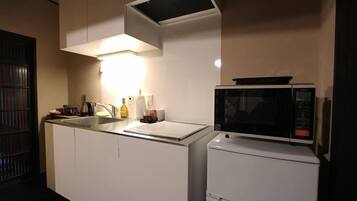 Japanese Style Townhouse | Private kitchen | Full-size fridge, microwave, stovetop, electric kettle