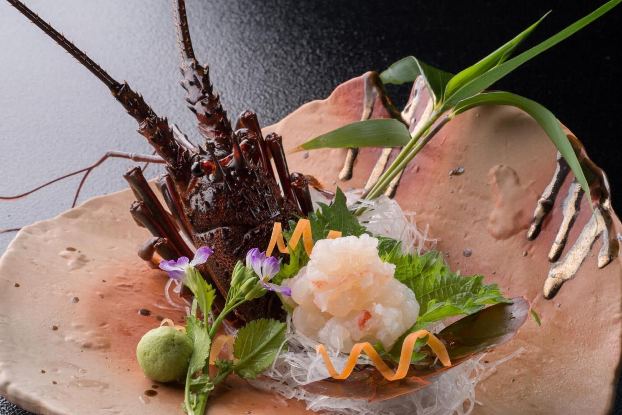 A dish with seafood and vegetables on a ceramic plate.