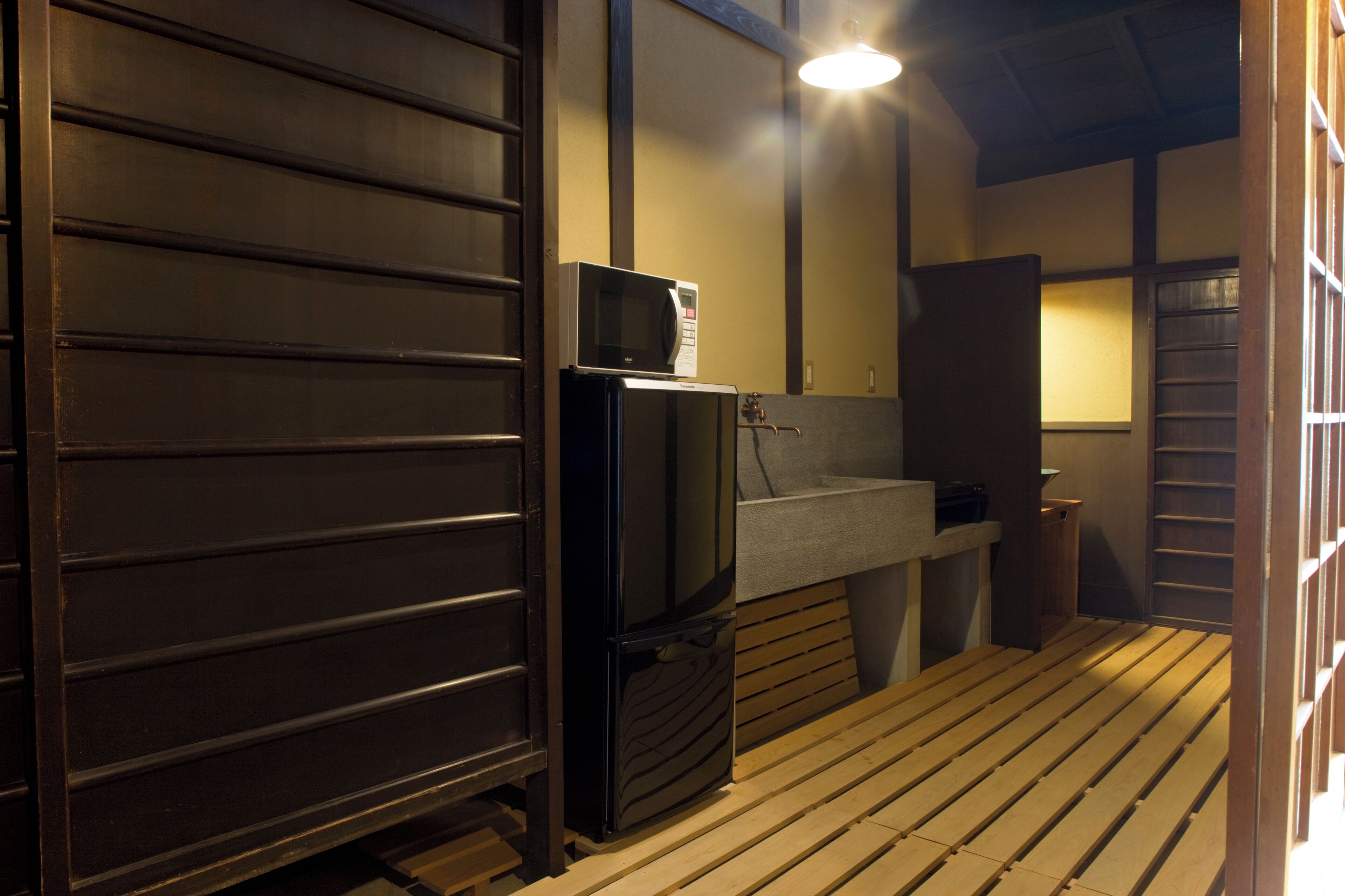 Japanese Style Townhouse | Private kitchen | Full-size fridge, microwave, stovetop, electric kettle