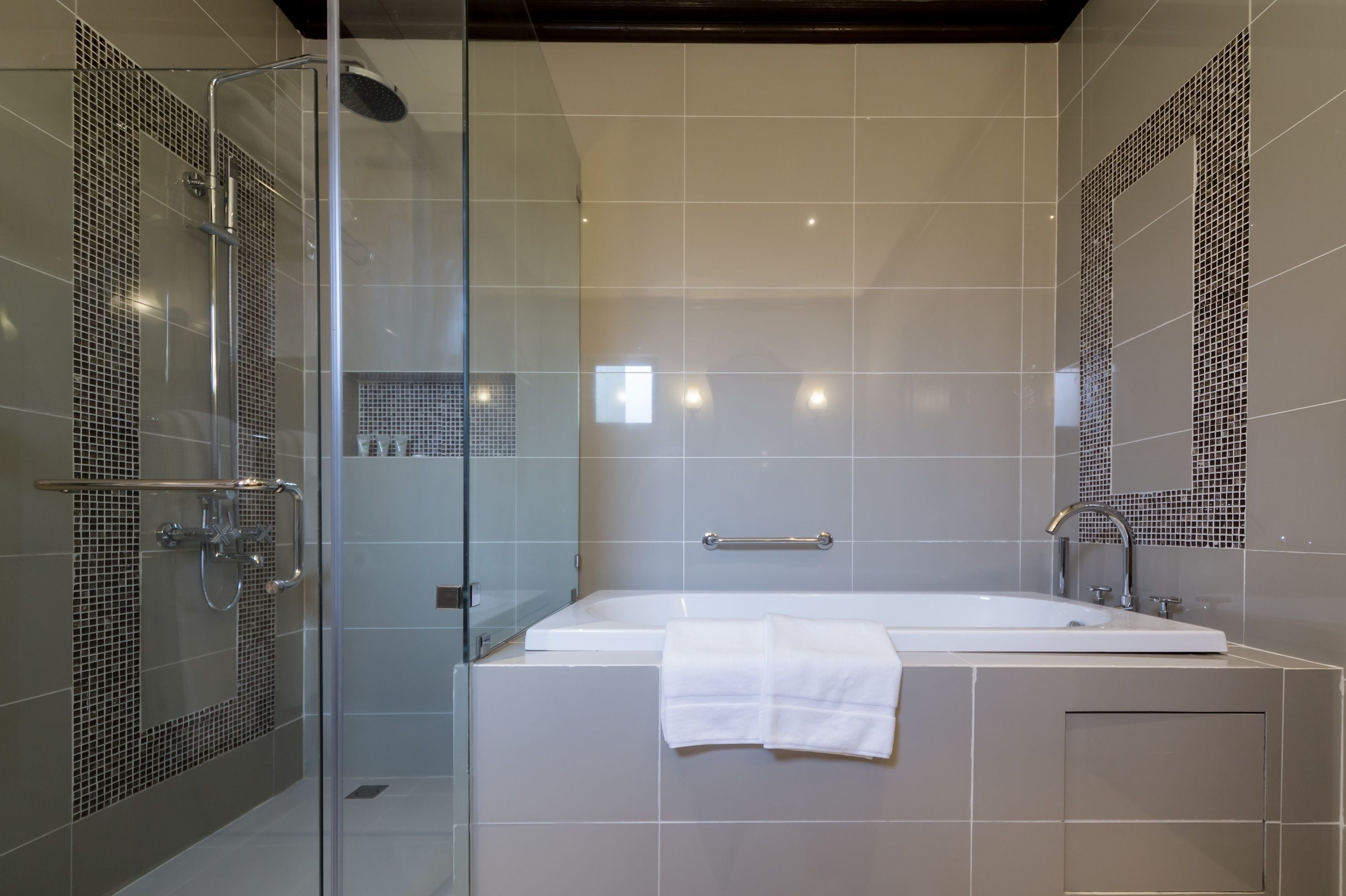 lagoon view suite | bathroom | shower, rainfall showerhead, free toiletries, bathrobes