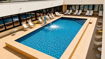 Outdoor pool, open 9:00 AM to 9:00 PM, pool loungers