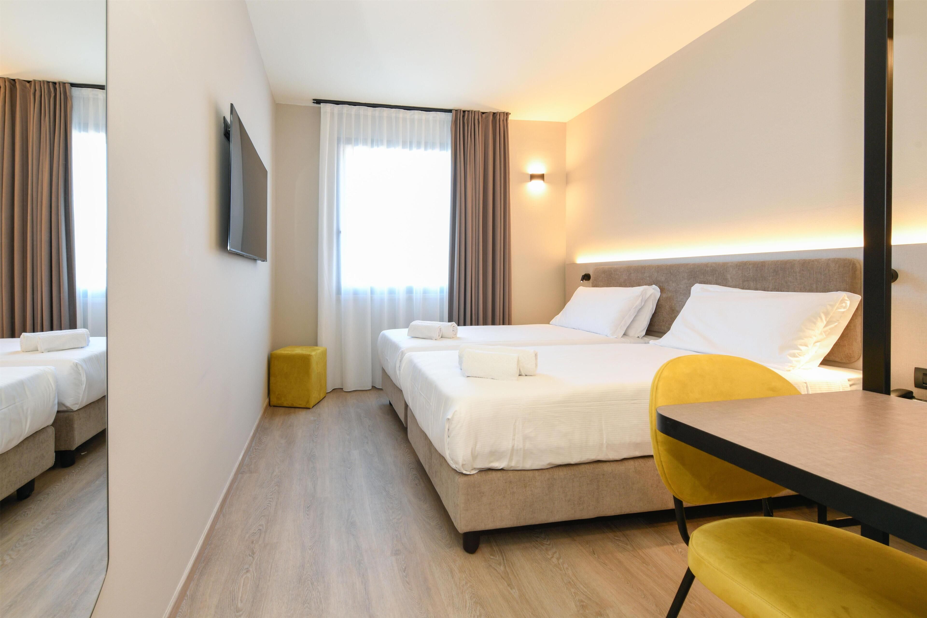 Hypo-allergenic bedding, in-room safe, desk, laptop workspace