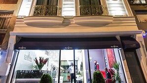 A hotel entrance with a glass facade, potted plants, and a sign reading "RAWDA". - Ravvda Hotel Bakırköy (Istanbul)
