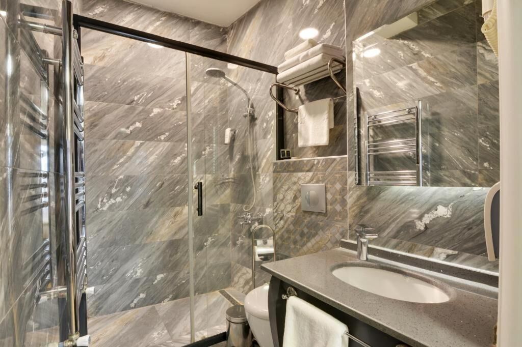 shower, hair dryer, slippers, towels