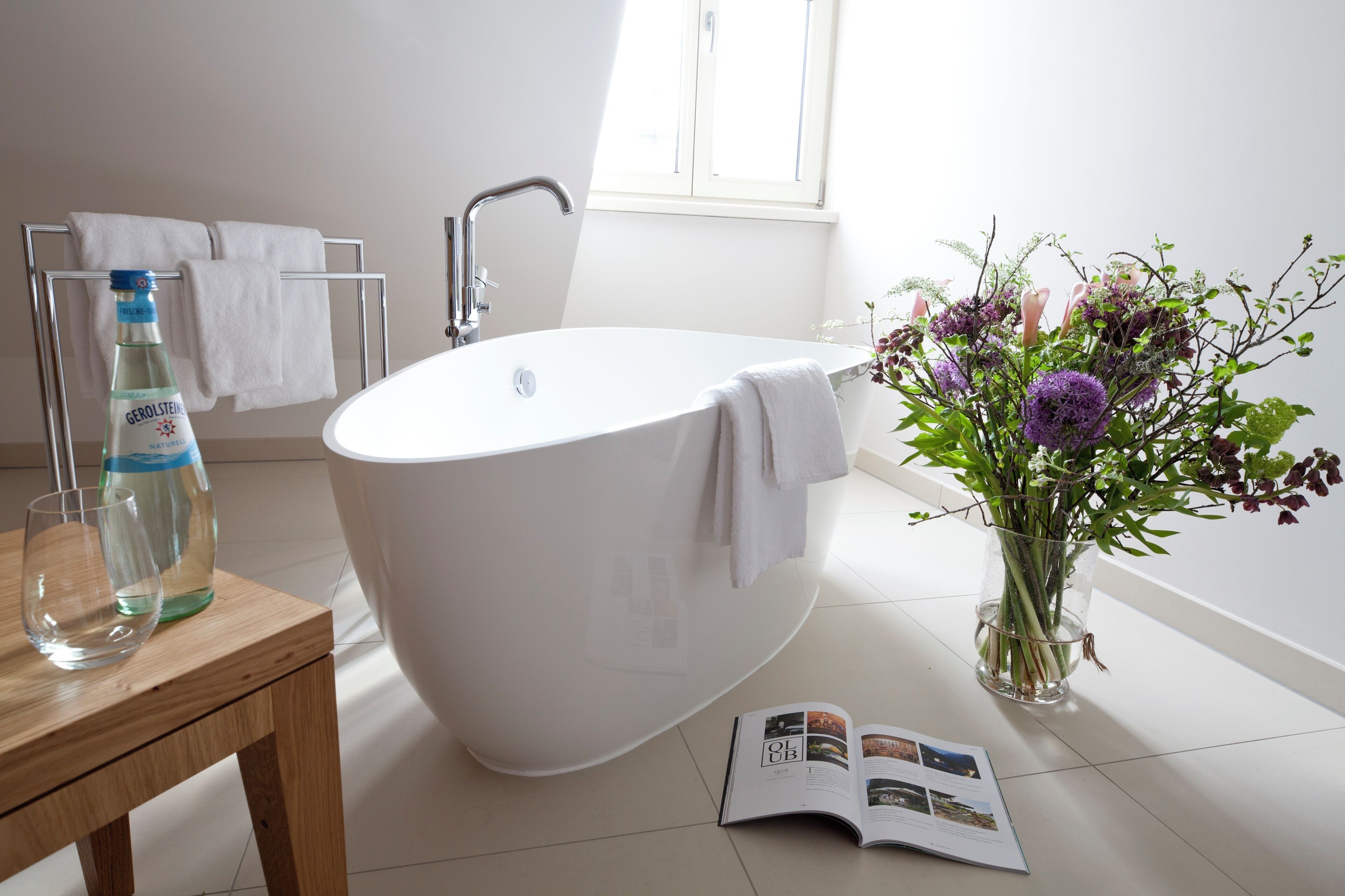 suite | bathroom | deep-soaking bathtub, rainfall showerhead, designer toiletries