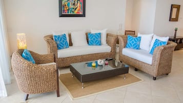 Three Bedroom Apartment, Beachfront | Living room | Flat-screen TV