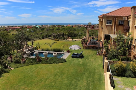 Outdoor pool, pool umbrellas, sun loungers