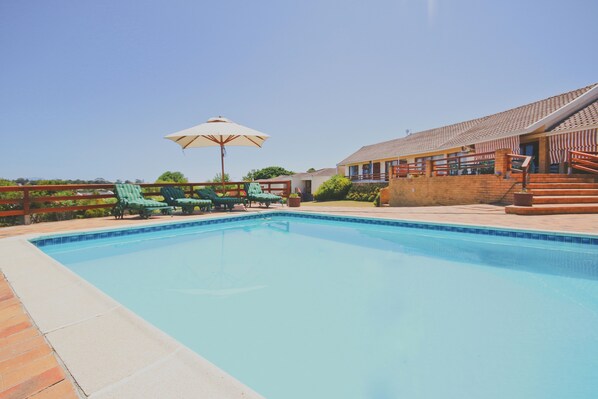 Outdoor pool, pool umbrellas, sun loungers