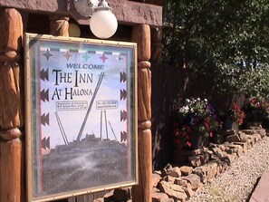 A welcome sign for The Inn at Halona with registration and information details.